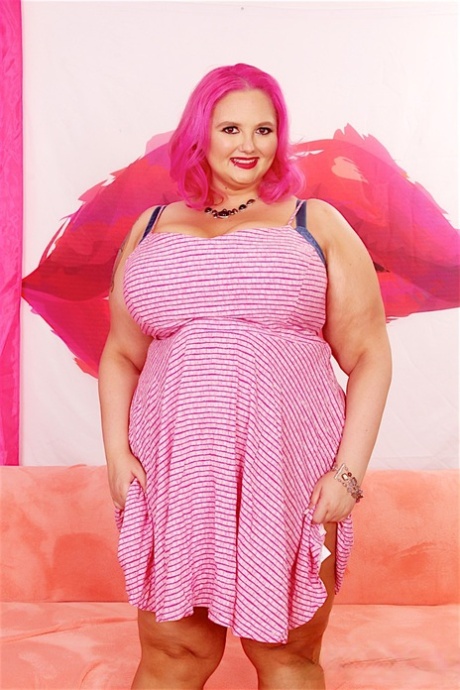Obese chick with pink hair Sara Star sucks a dick after getting totally naked