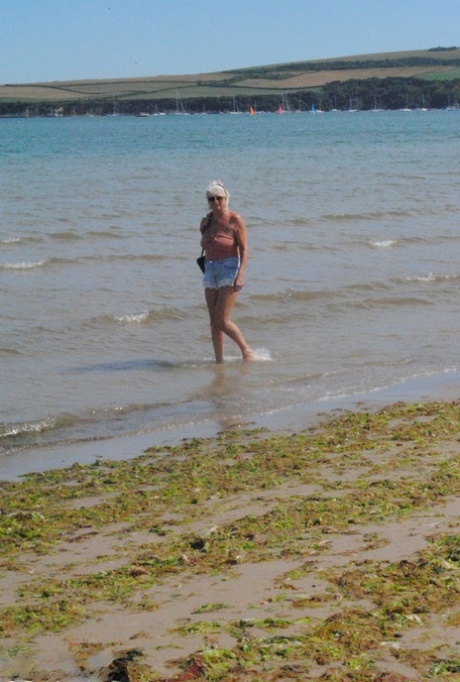 Mature granny Dimonty skinny dipping at the beach with big saggy tits hanging