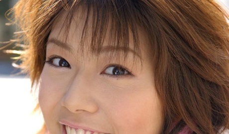 Japanese MILF Mai Haruna undoes her winter coat while wearing a bra and thong