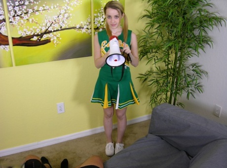 Cheerleader uncovers hers boobs while giving a POV handjob in pigtails