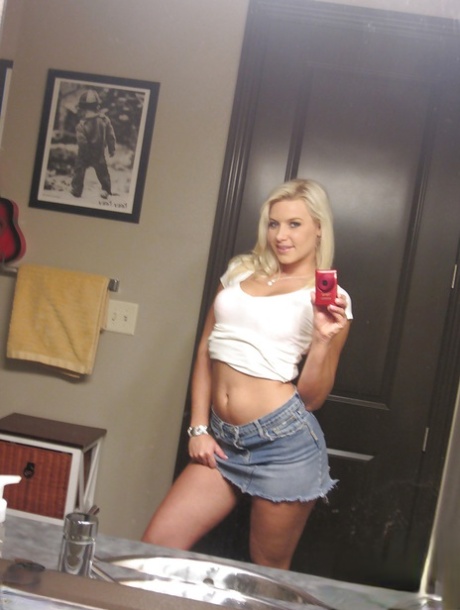 Blonde whore with huge ass Annika undressing for her sexy photos