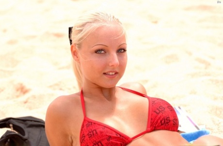 Blonde Czech lovely Zia wears red swimsuit and looks like a goddess