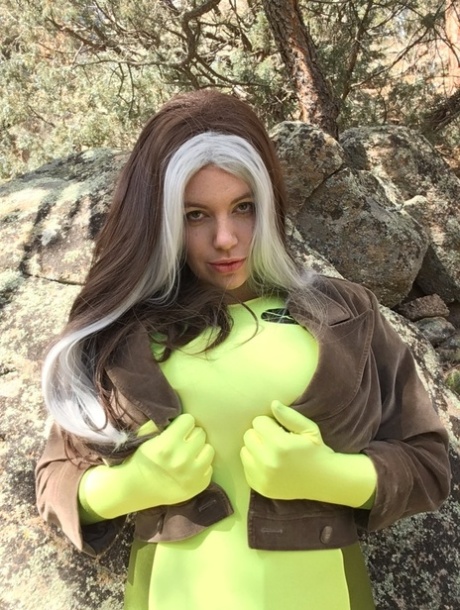 MILF Lovely Lilith lets out her massive breasts and flaunts them outdoors